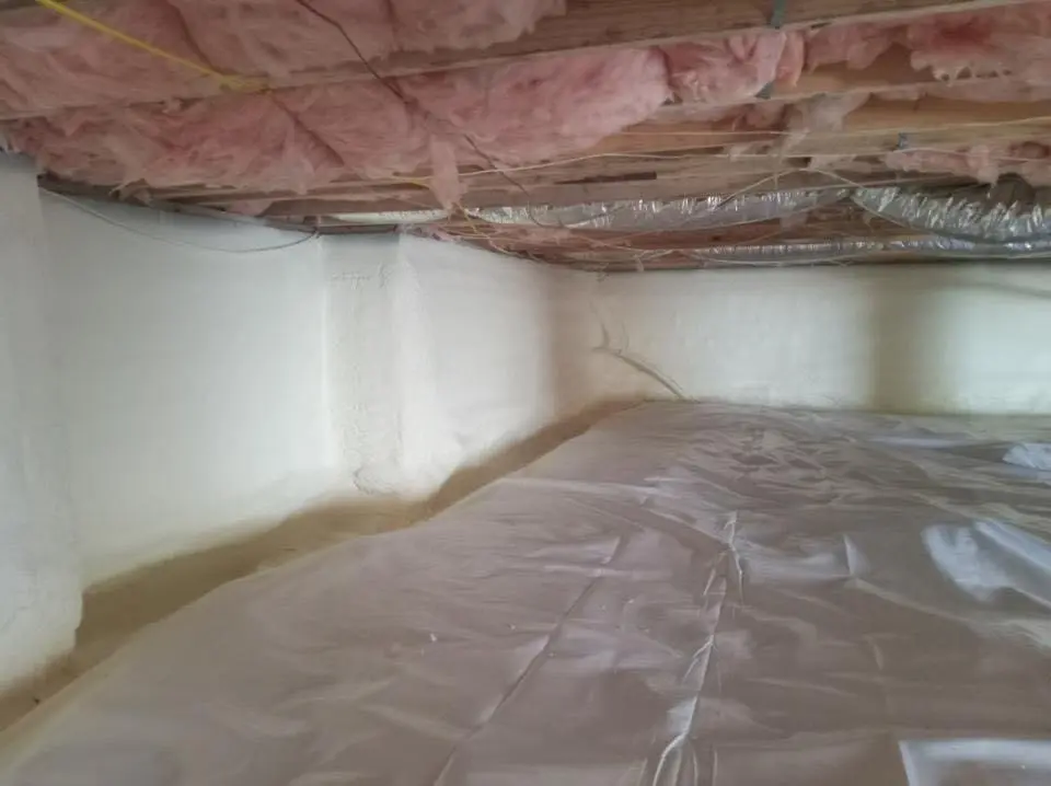 Crawl space encapsulation with closed-cell spray foam for Commercial Roof Restoration in Ogdensburg